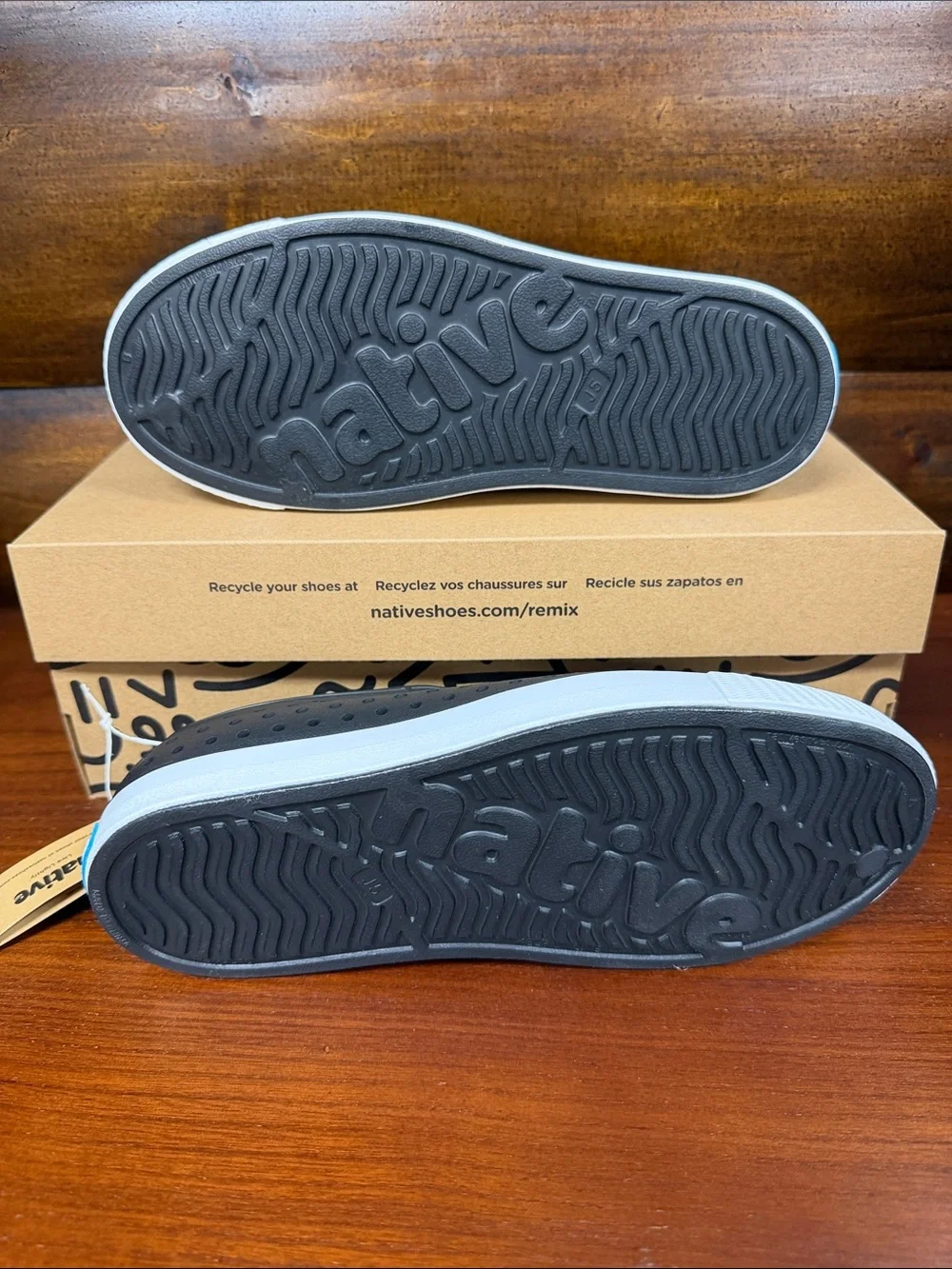 Kids Native Slip-On Perforated Sneakers in Black and White